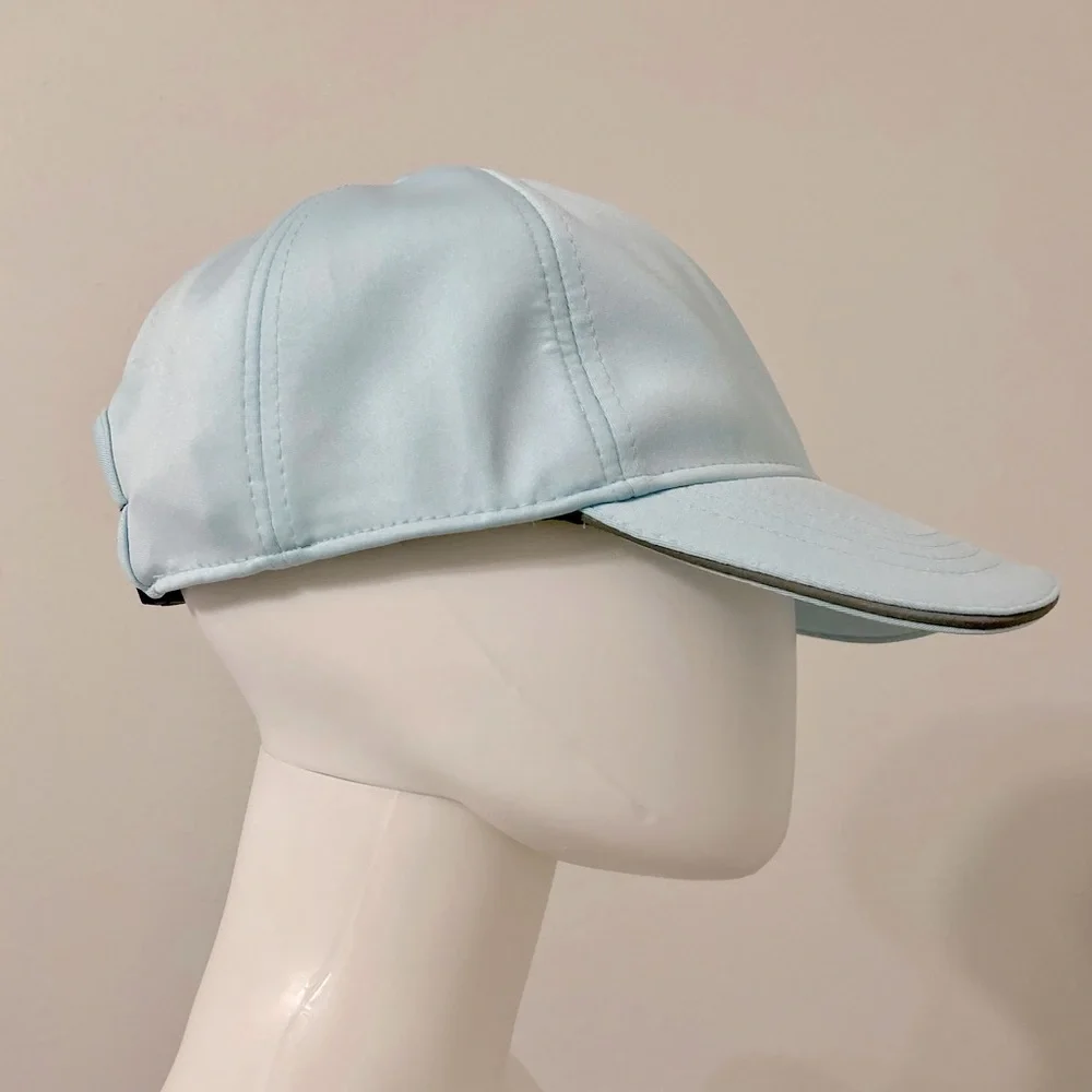 light blue baseball cap with reflective stripe on the peak self-adjusting .